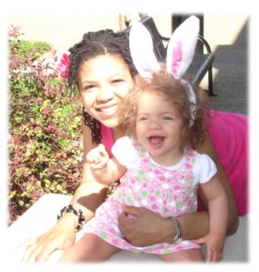 adopting a child with Angelman syndrome | Angelman Syndrome News | Sabrina Johnson has her arm around Juliana, 1, who is wearing rabbit ears for Easter